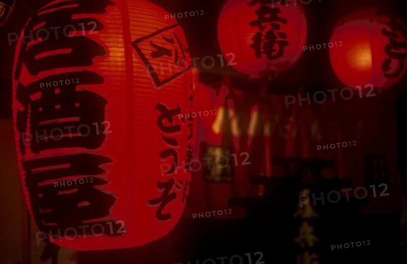 JAPAN, Honshu, Tokyo, Chochin Red Lanterns outside Izakaya Bar in Ichikawa district. Writing says Irrashaaimasen or Welcome.