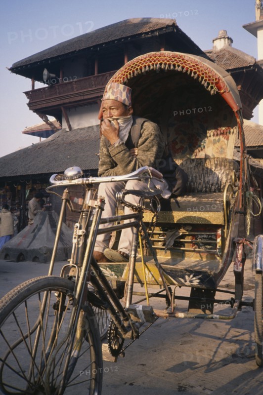 NEPAL, Kathmandu, Durbar Square Rickshaw and driver