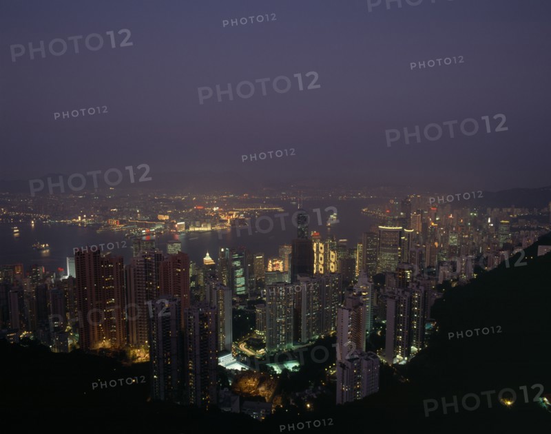 HONG KONG, Victoria Peak   , Elevated view over the harbour illuminated at night with skyscrapers and the Bank of China