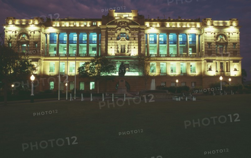 AUSTRALIA, Queensland, Brisbane, State buildings floodlit at night.