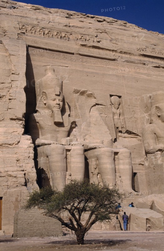 EGYPT, Nile Valley, Abu Simbel, Sitting statues of Ramses the second at the temple carved in to a sandstone cliff