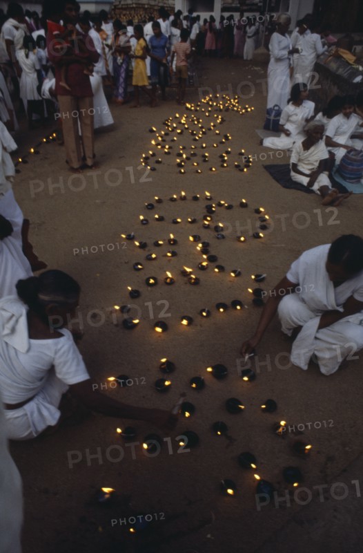 SRI LANKA, Anuradhapura, Lighting lamps during Wessac.