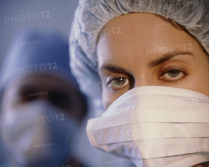 MEDICAL, Surgery, Nurse, Portrait of female member of surgical team wearing mask and cap