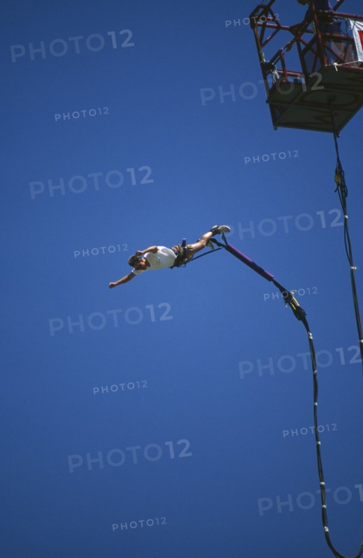 SPORT,  , Bungee Jumping, Man diving from a crane with elastic cord tied to his ankles