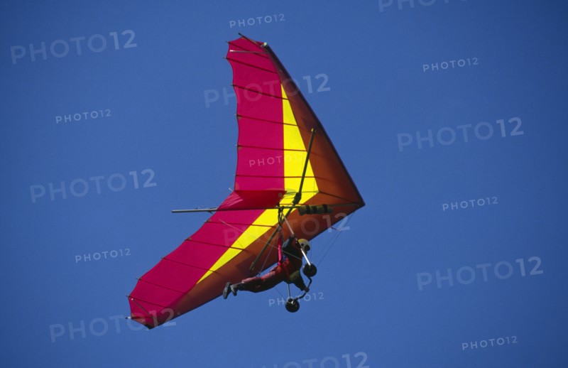 10036941 SPORT Air Gliding View looking up at hang glider in the sky.