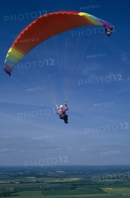 10037036 SPORT Air Paragliding Paraglider with multicoloured chute.