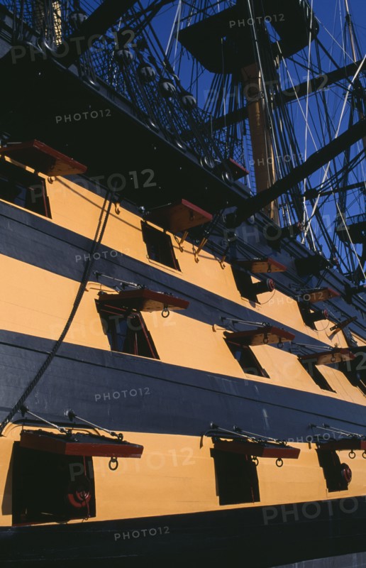 ENGLAND, Hampshire, Portsmouth, HMS Victory.  Part view of side of ship and openings from where cannons were fired.