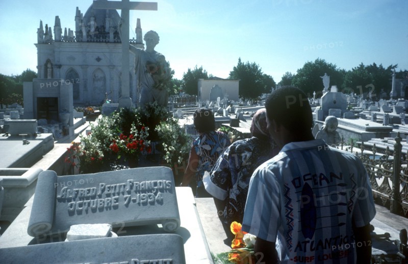 CUBA, Havana, People walking through graveyard on Fathers Day
