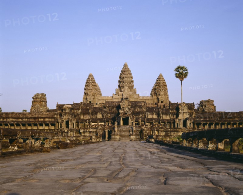 CAMBODIA, Angkor, Angkor Wat.  Causeway leading to main temple and triple pagodas.