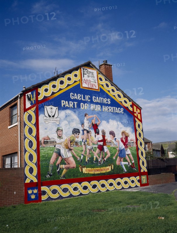 N.IRELAND,  , Belfast, Ardoyne mural depicting traditional Gaelic sports.