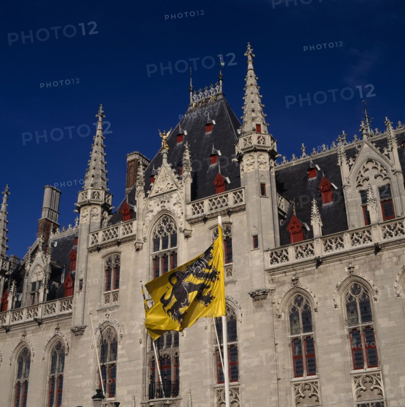 BELGIUM, West Flanders, Bruges, "Main Square, Markt, Post Office building & flags "