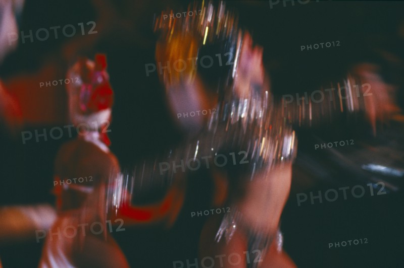 CUBA, Havana Province, Havana, Club Tropicana dancers in blurred movement through long camera exposure