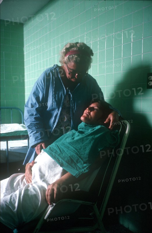 CUBA, Havana, Pregnant woman in labour being attended by hospital nurse