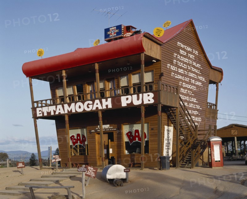 AUSTRALIA, New South Wales, Near Albury, Ettamogah Pub an unusual timber building with a red roof and odd signs