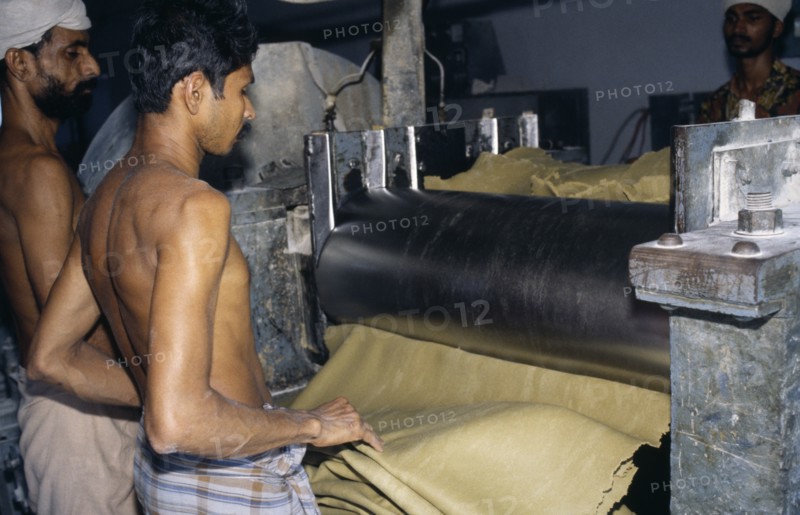 INDIA, Kerala, Industry, Workers in rubber factory.