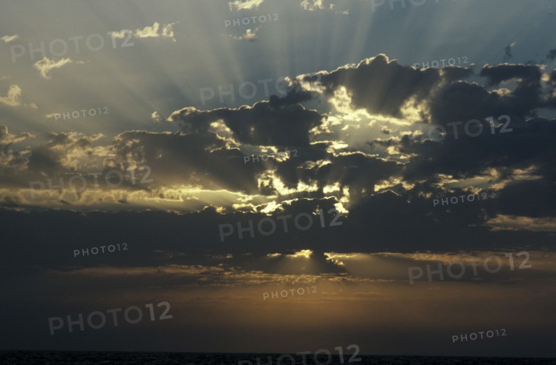 WEATHER , Climate, Clouds, Sun beams through clouds over the sea