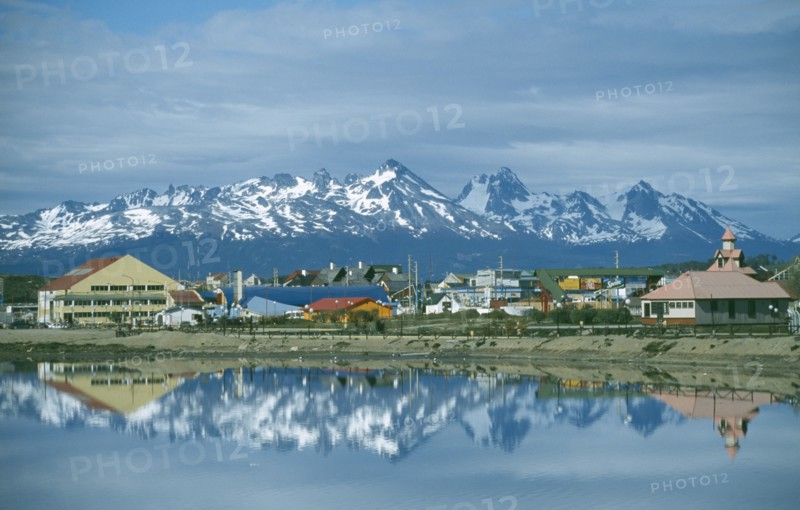ARGENTINA, Patagonia, Tierra del Fuego, "Ushuaia, view of town with snowcapped mountains of Chile across water "