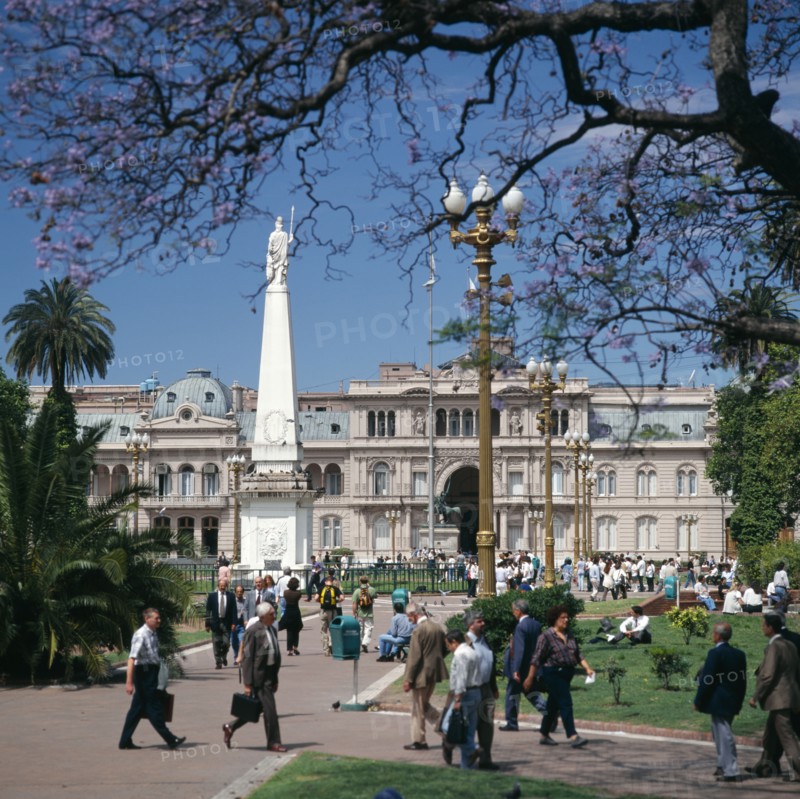 ARGENTINA, Buenos Aires, "Plaza de Mayo, Piramide de Mayo, Casa Rosada, people, Jacaranda tree "