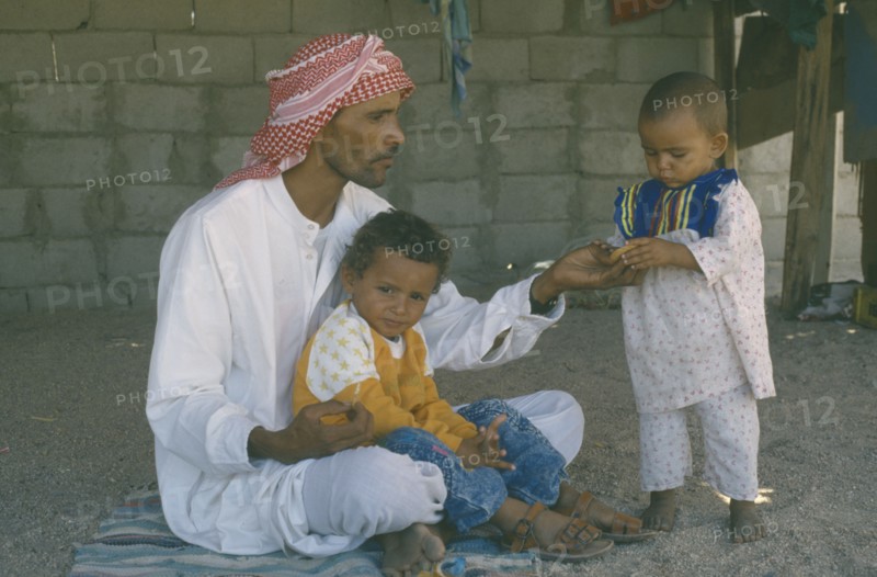 EGYPT, People, Bedouin man with his two young children.