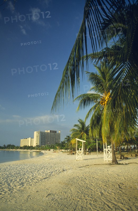 WEST INDIES, Jamaica, Ocho Rios , Beach with hotel in the distance