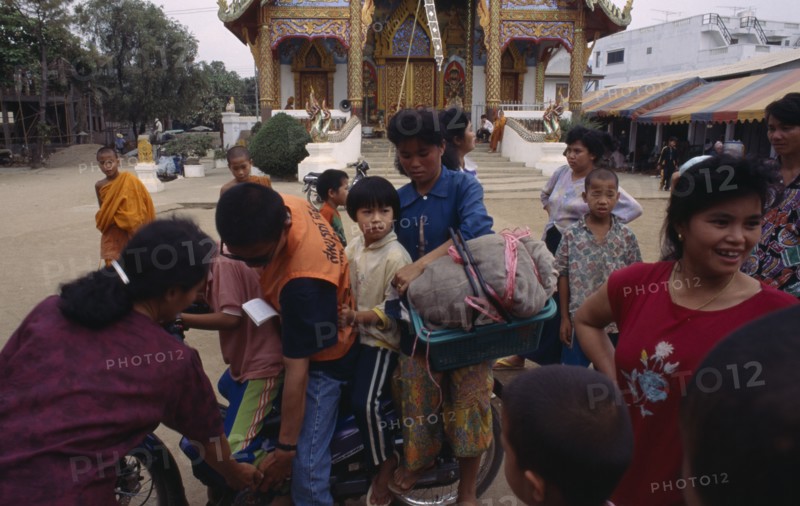 THAILAND, North, Mae Sai, Karen refugee family on a motorbike
