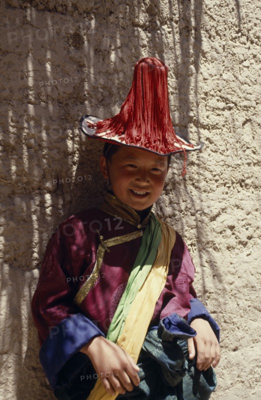 CHINA,  , Qinghai, Young Tibetan boy dressed in festival dancing costume
