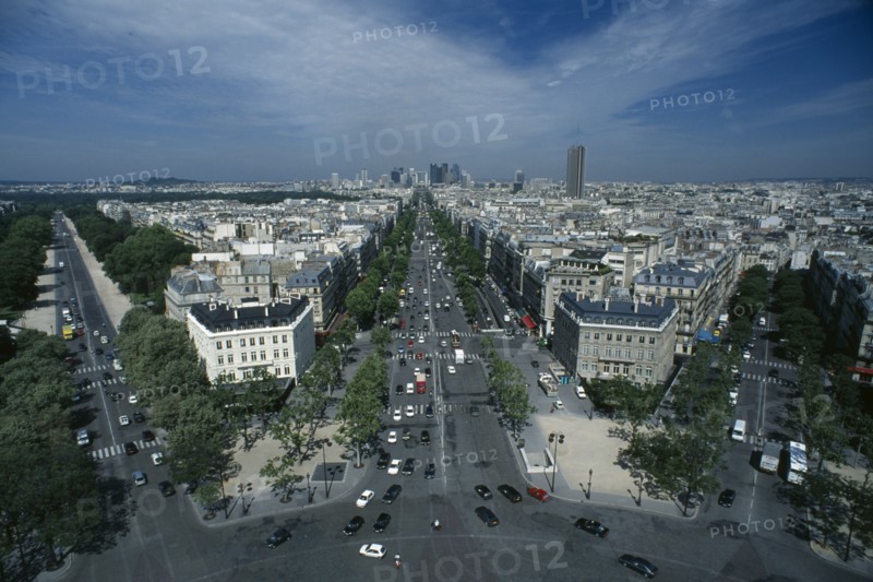 FRANCE, Ile De France, Paris, A view over the city and down the Avenue de la Grande Armee and Avenue Foch towards La Defence from the top of the Arc de Triomphe