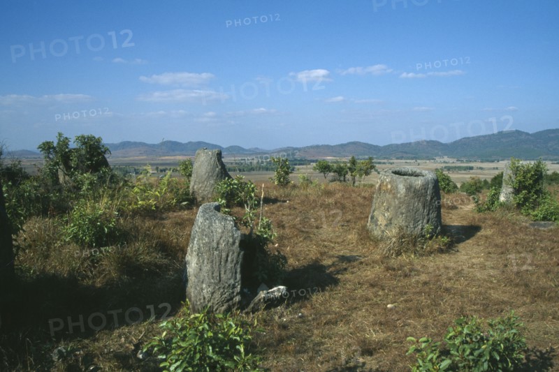 LAOS, Near Phonsavan, Plain of Jars. Landscape with huge scattered stone jars of unknown origin.