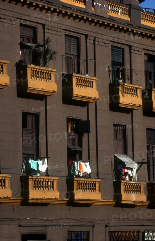 CUBA, Havana , Brown coloured balconies with hanging washing