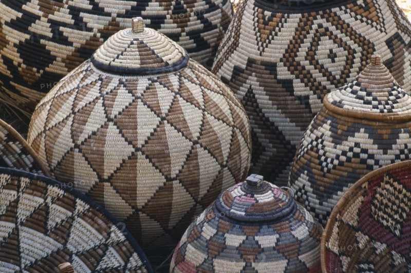 SOUTH AFRICA, Zululand  , Baskets woven by Zulu women made from Lala Palm and coloured with juices from tree roots.
