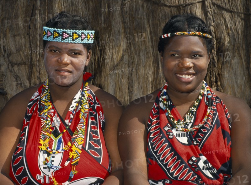 SWAZILAND, Tribal Peoples, Local women in traditional tribal dress and head bands.