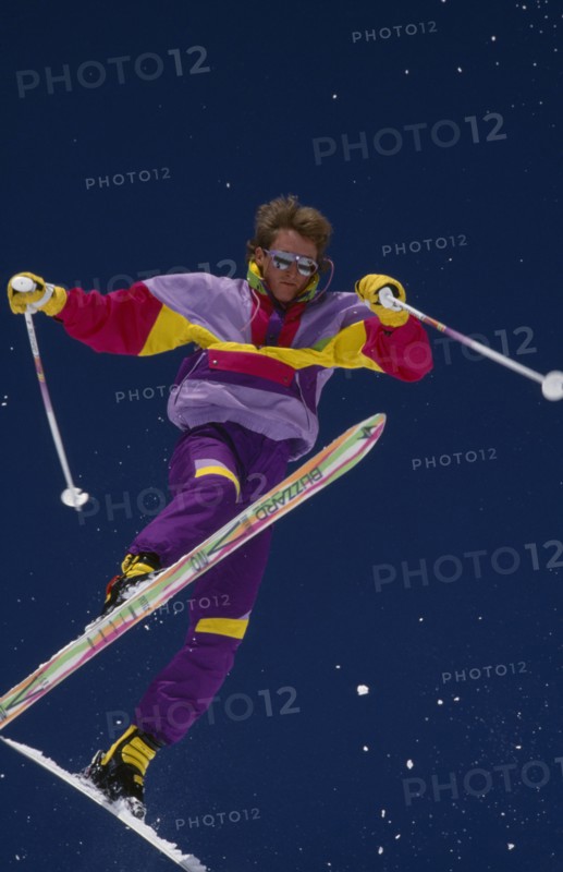 USA, Colorado , Vail, Lone acrobatic skier in mid air pose against deep blue sky