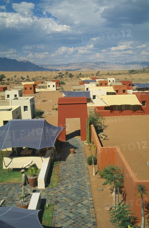 NAMIBIA, Namib Desert, Sussusvlei, Karos Lodge. View over cluster of Hotel buildings on the edge of the desert