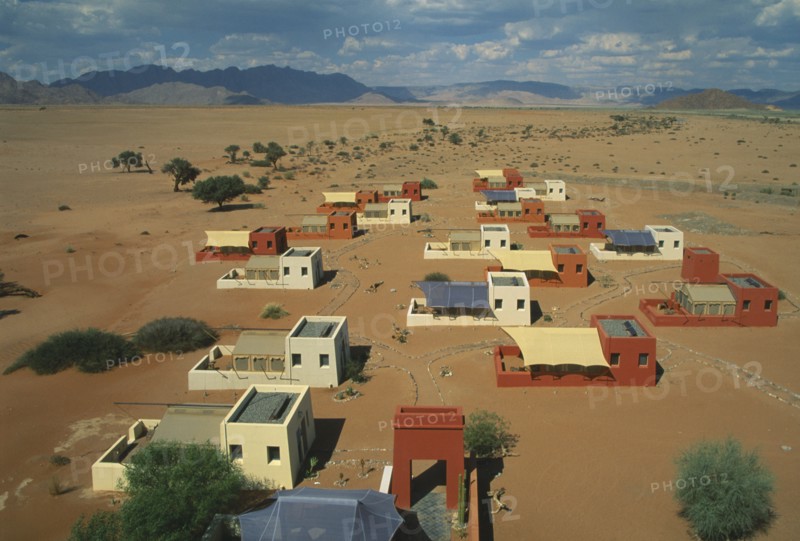 NAMIBIA, Namib Dessert, Sussusvlei, Karos Lodge. View over cluster of Hotel buildings on the edge of the desert