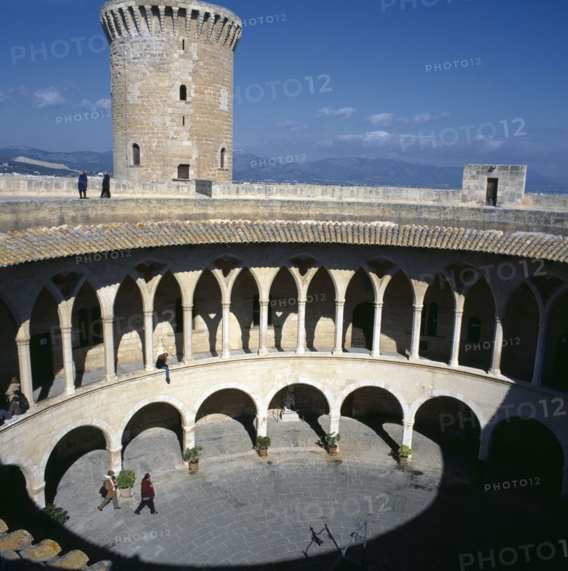 SPAIN, Balearic Islands, Majorca, Palma. View over Bellver Castle courtyard Mountains in distance