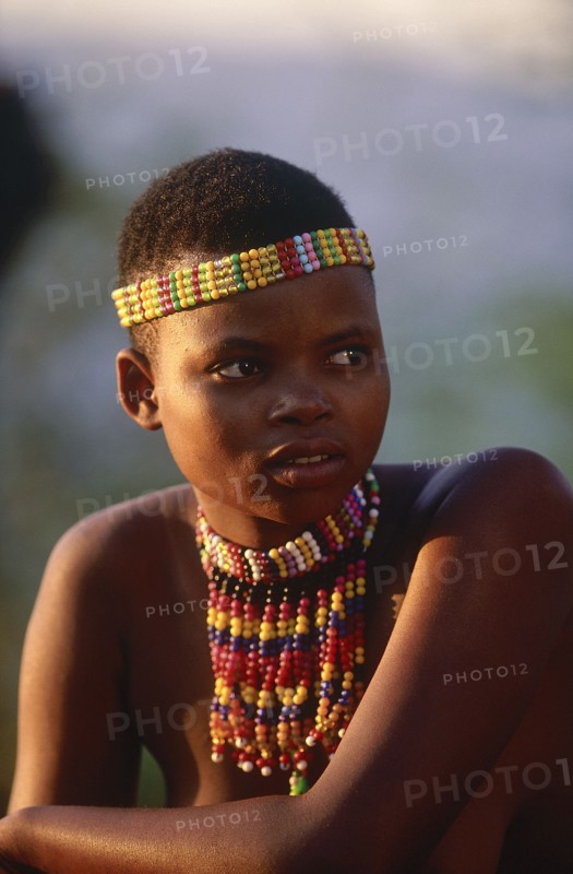 SOUTH AFRICA, KwaZulu Natal, Shakaland , Zulu woman with an ujelasi necklace and head band