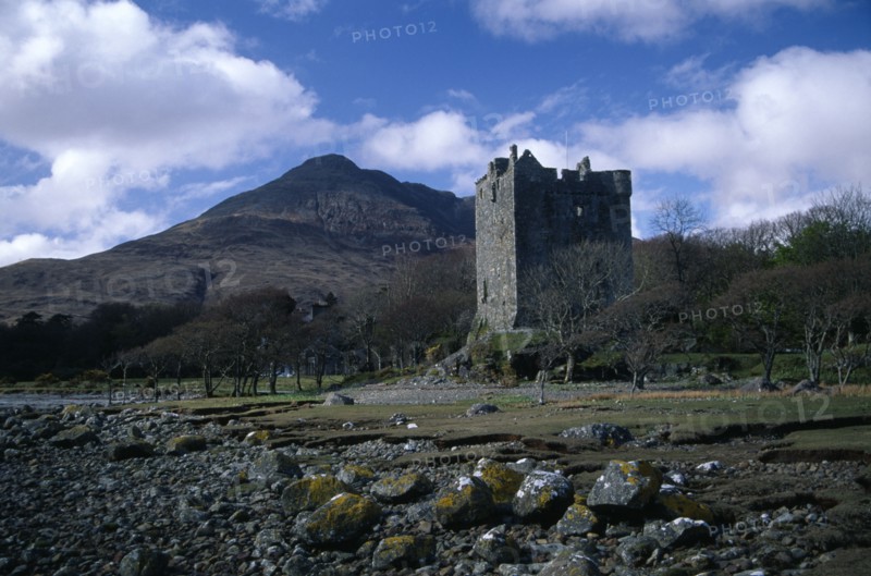 SCOTLAND, Argyll and Bute, Isle of Mull, "Moy Castle on the shores of Loch Bui, mountain peak behind. "