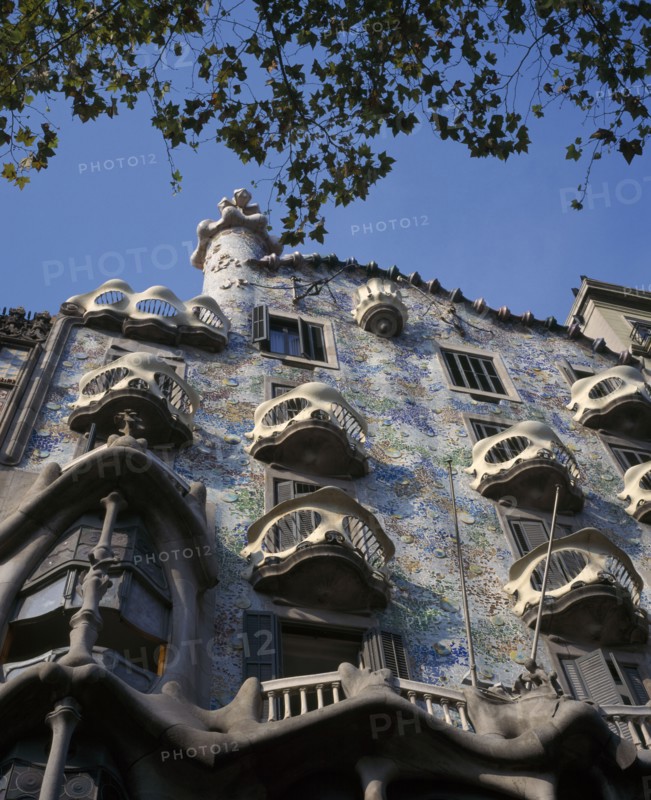 SPAIN, Catalonia, Barcelona, Casa Batllo by Antoni Gaudi. Manzana de la Discordia or Block of Discord at 43 Passeig de Gracia.  Exterior facade.