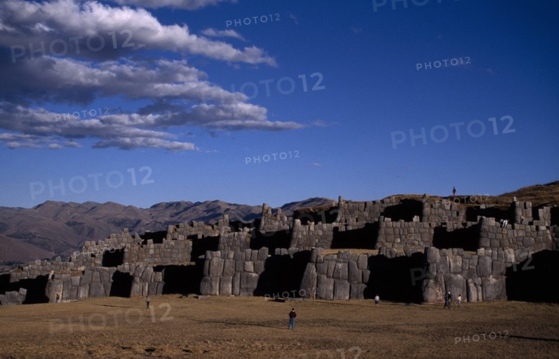 PERU, Cusco, Sacsayhuaman, 15th Century Inca fortress ruins built from enormous bolders with nearby tourists