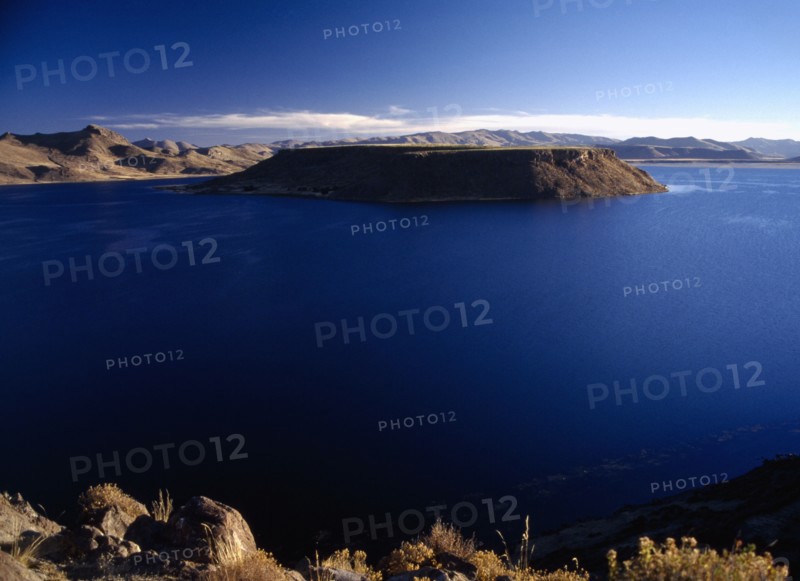 PERU, Puno Administrative Department, Sillustani, Lake Ayumara with island in the centre of the blue water