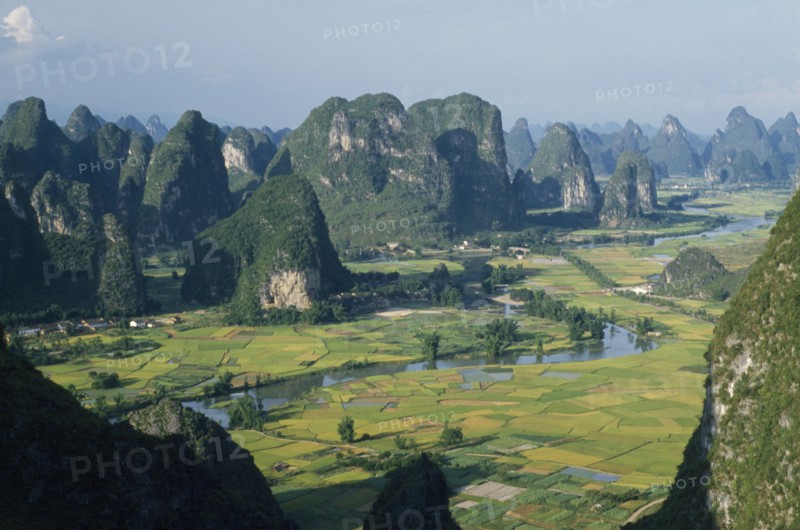 CHINA, Guangxi, Near Guilin , View from Moonhill with Karst limestone formations around the river valley with rice paddies