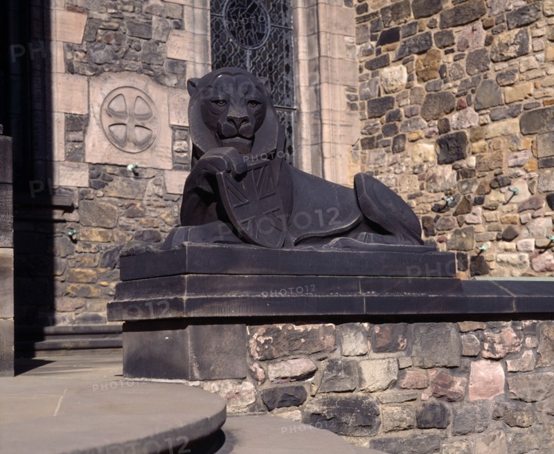 SCOTLAND, Lothian, Edinburgh, Holyrood House. Stone statue of lion holding shield next to steps
