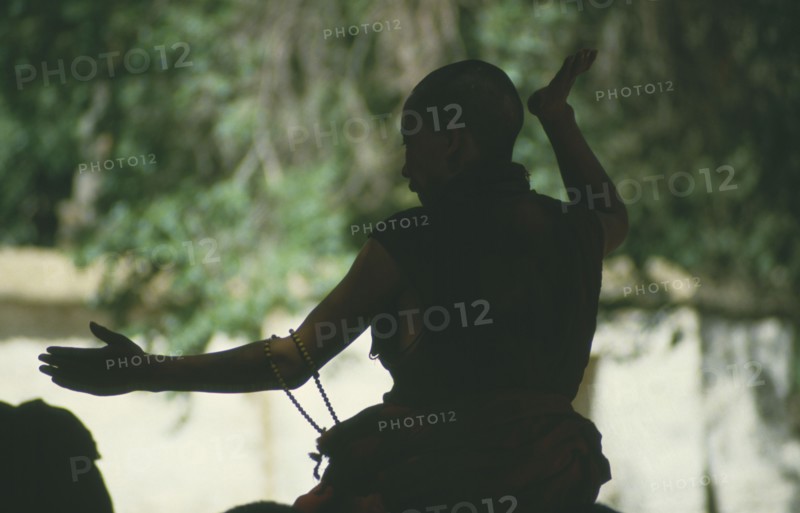 TIBET, Lhasa, Silhouette of debating monk