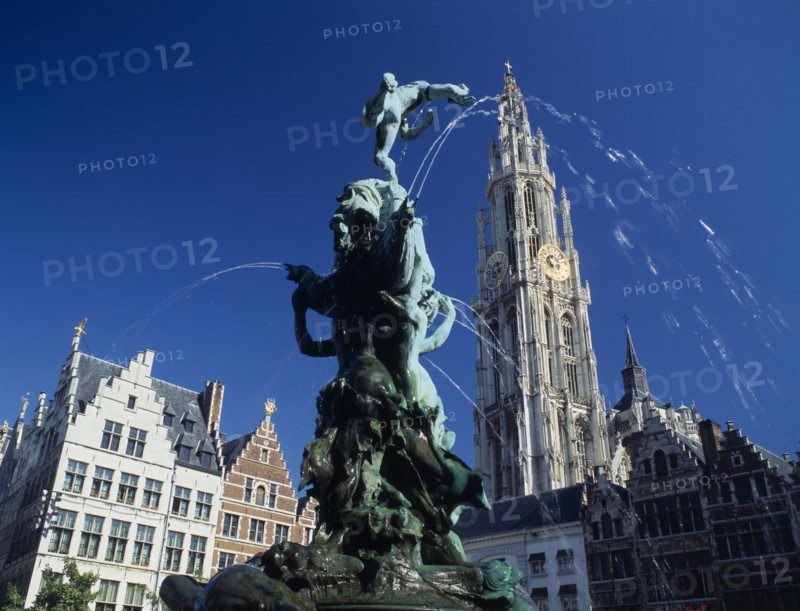 BELGIUM, Flemish Region, Antwerp, "The Brabo Fountain, tower of Our Lady's Cathedral & Main Square, Grote Markt facade."