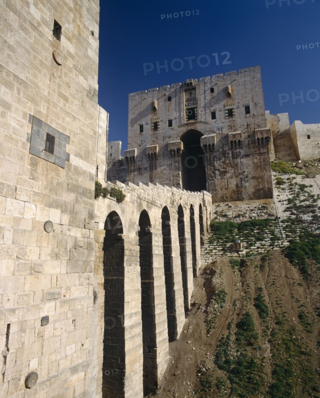 SYRIA, Aleppo,   Halab, "The Citadel, stone, fortified, arched viaduct walk to entrance "