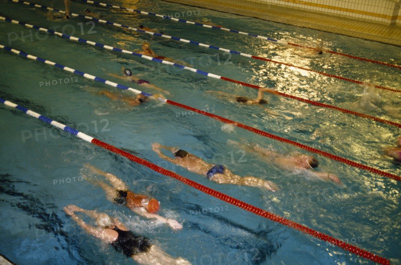 10086928 SPORT Water Sport Swimming Swimmers in lanes of indoor pool.
