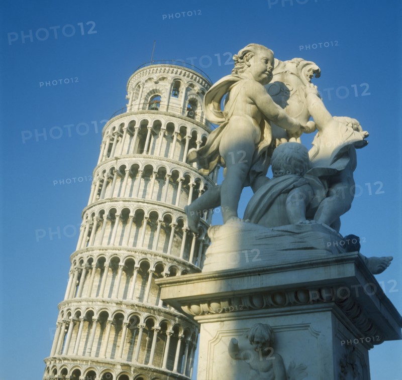 ITALY, Tuscany, Pisa, Leaning Tower with a statue in the foreground