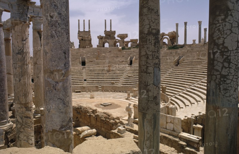 LIBYA, Tripolitania, Leptis Magna, The Roman amphitheatre seen from the stage area through columns