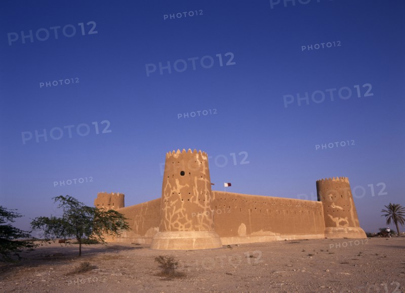 QATAR, Zubara, "Exterior view of a fort with crenellated towers, built in 1938 and used as a police border post, now a museum.  "