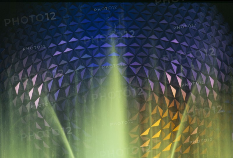 USA, Florida, Orlando, Walt Disney World Epcot Center Spaceship Earth illuminated at night through fountain